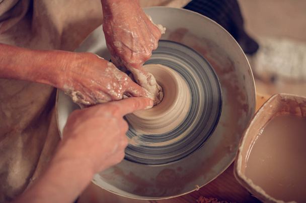 Top view of a pottery wheel rolling - 写真・画像