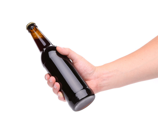 A bottle of beer in a hand - Photo, image