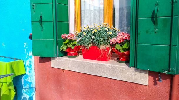 Authentic window with green shutters in Mediterranean style old window against stone wall - Photo, Image