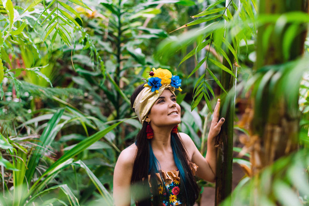 Brazilian girl in national jungle costume. Very beautiful and cute girl smiling and laughing in the green - Valokuva, kuva