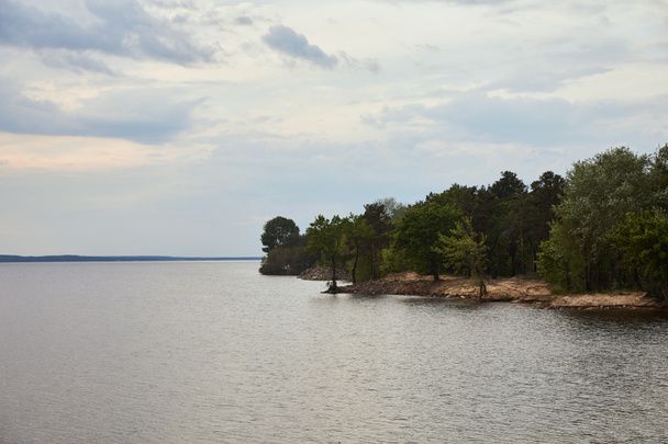 view of white sky, river and forest on coast  - Photo, Image