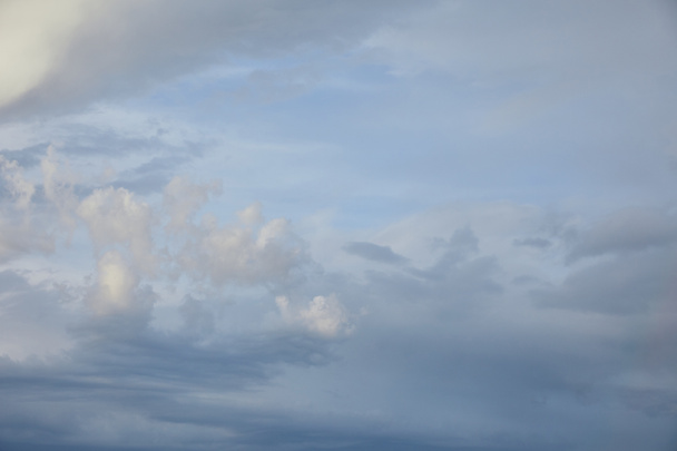 view of grey clouds on blue sky background - Foto, Imagem
