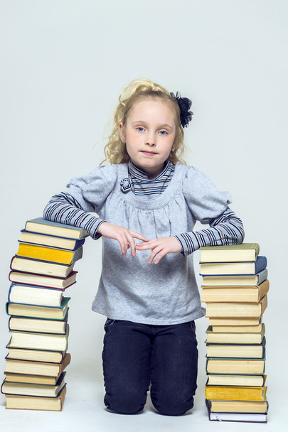 girl with a lot of books - Photo, image