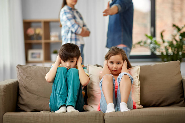 sad children and parents quarreling at home - Foto, Imagen