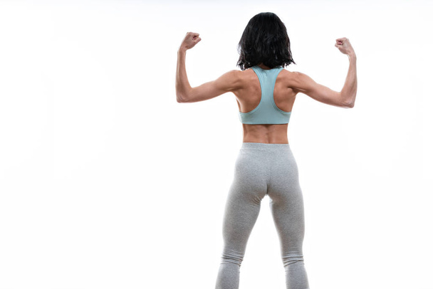 back of athletic girl. gym concept. muscular fitness woman, trained female body.healthy lifestyle. dope topic - Foto, imagen