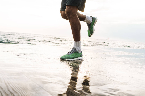 Young african sports man runner outdoors at the beach sea running make exercises. - Valokuva, kuva