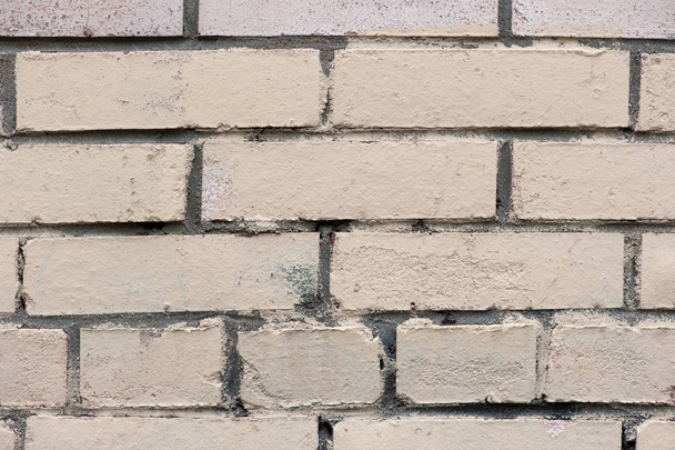 Old painted beige color weathered stained brick wall - Foto, Imagen