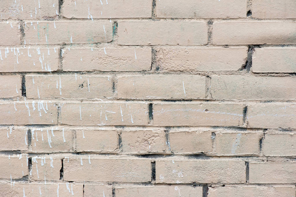 Old painted beige color weathered stained brick wall - Photo, Image