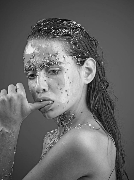 Woman with Candy sprinkle lips holding thumb in mouth - 写真・画像