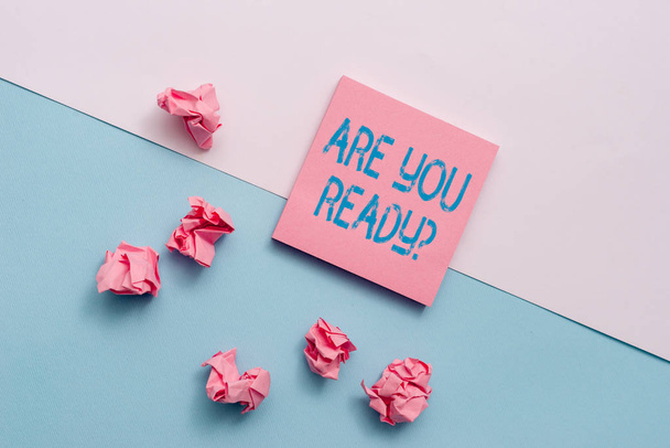 Text sign showing Are You Ready Question. Conceptual photo used telling someone start something when feel prepared Note papers and stationary placed sideways on top of softhued backdrop. - Foto, afbeelding