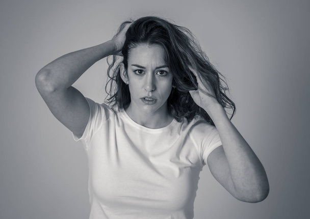 Black and white portrait of attractive frustrated caucasian woman with angry and stressed face looking mad and crazy shouting and making furious gestures. Copy space. Facial expressions and emotions. - Foto, Imagem