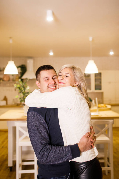 beautiful couple having fun in the kitchen  - Foto, Bild