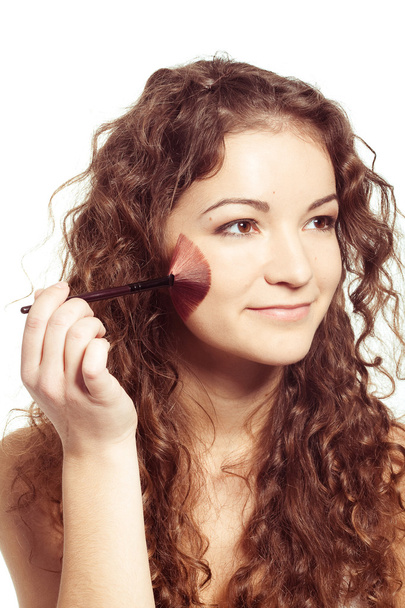 Young beautiful woman with make up tools - Фото, изображение