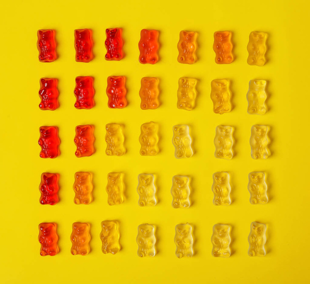 Flat lay composition with delicious jelly bears on color background - Fotoğraf, Görsel