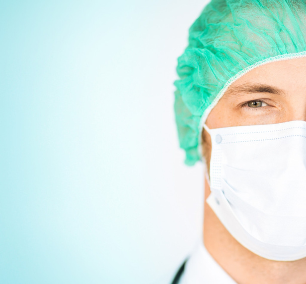 Surgeon in medical cap and mask - Photo, Image