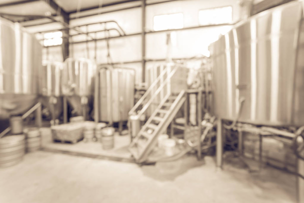 Filtered image blurry background stainless steel brewing equipment at American brewery - Photo, Image