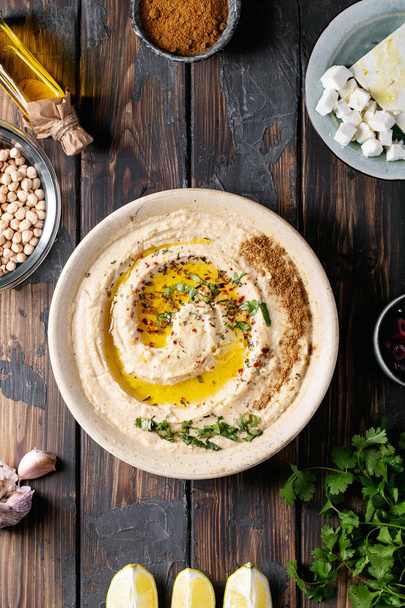 Hummus with olive oil and ground cumin - Photo, Image
