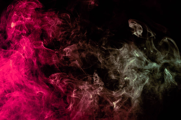 Beautiful column of smoke in the neon bright light of red, green - Photo, Image