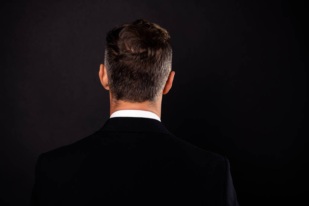 Close-up rear back behind view portrait of his he nice attractive well-groomed chic guy wearing jacket blazer isolated over dark black background - Valokuva, kuva
