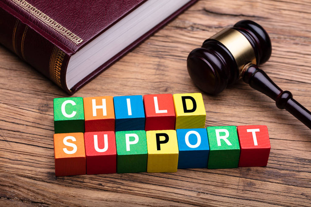 Child Support Colorful Block With Bible And Hammer Over Wooden Desk In Courtroom - Foto, Imagen