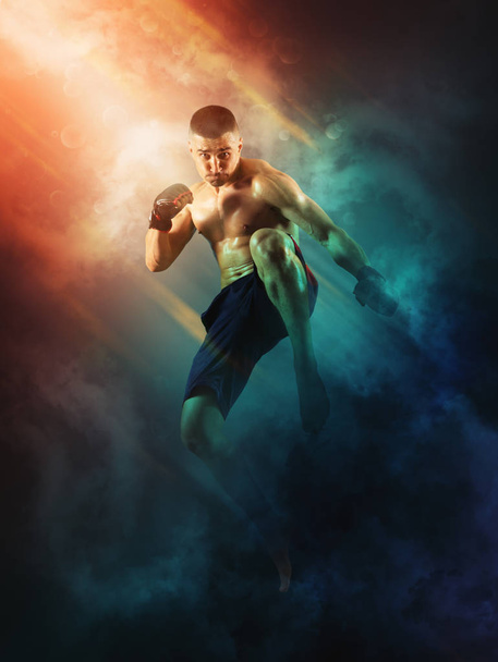 MMA male fighter jumping - Фото, изображение