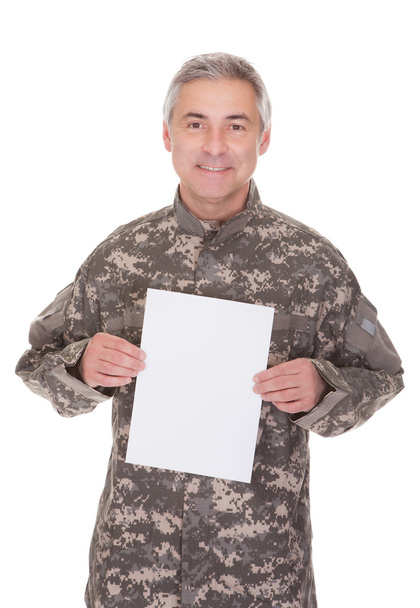 Mature Soldier Holding Blank Paper - Фото, изображение