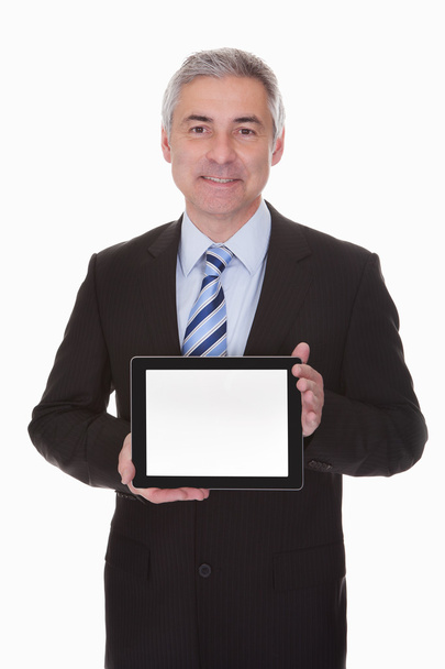 Mature Businessman Showing Digital Tablet - Fotó, kép