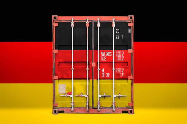  The concept of  Germany export-import, container transporting and national delivery of goods. The transporting container with the national flag of germany, view front - Foto, Imagem