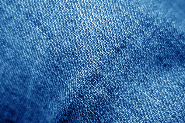 Jeans cloth pattern in navy blue color with blur effect. - Photo, Image