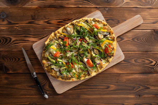 pizza with vegetables and truffle oil on wooden background - Fotoğraf, Görsel