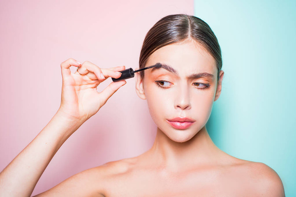 Beauty routine. Girl hold cosmetic applicator. Woman put makeup on her face. Daily makeup concept. Makeup and cosmetics. Girl healthy shiny skin put makeup on. Add more details. Fashion model - 写真・画像