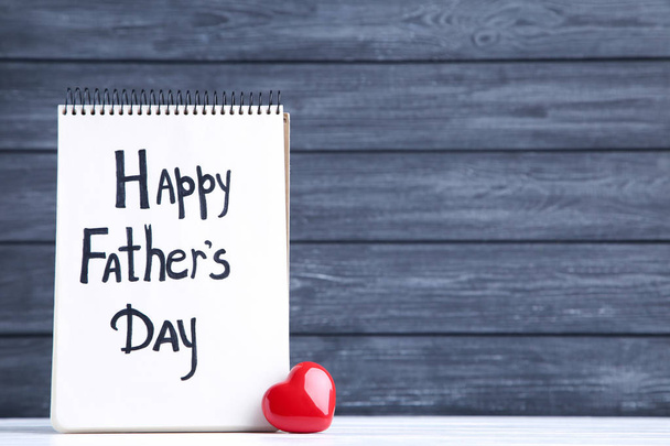 Text Happy Fathers Day with red heart on black background - Foto, imagen