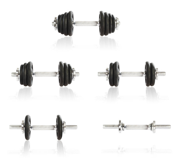 Dumbbells with different amount of weight plates - Photo, Image