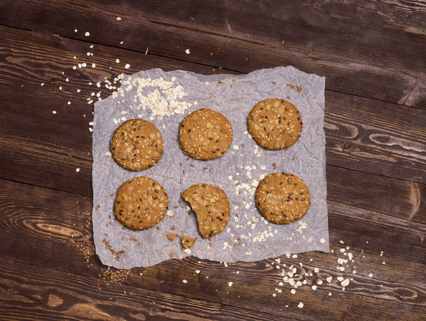Useful cookies with flax, sesame, sunflower seeds and roasted oat grains. Homemade baking. - Photo, Image