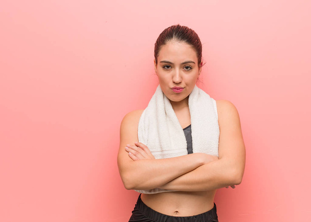 Young fitness woman crossing arms relaxed - Photo, Image