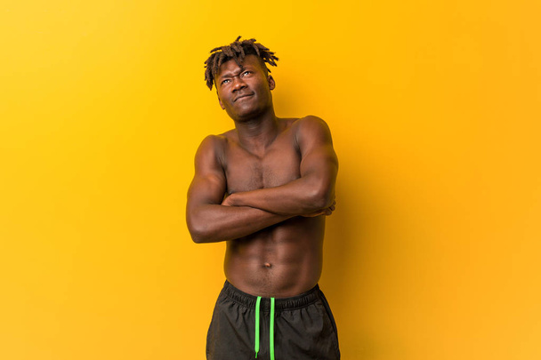 Young black man shirtless wearing swimsuit smiling confident with crossed arms. - Photo, Image