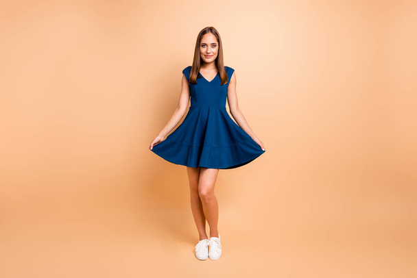 Full length body size view of her she nice-looking lovable groomed smart content attractive charming lovely cheerful lady wearing blue dress posing isolated over beige pastel background - Photo, Image