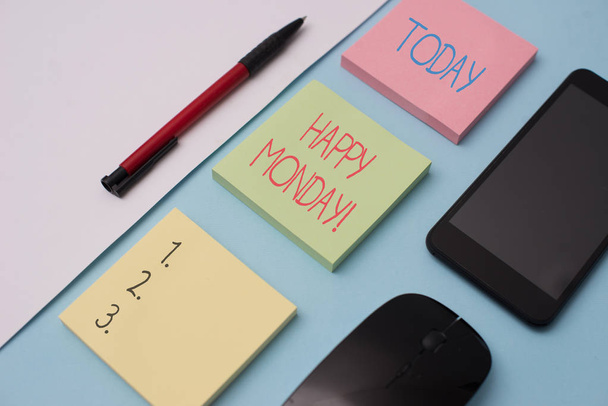 Writing note showing Happy Monday. Business photo showcasing telling that demonstrating order to wish him great new week Note papers and stationary plus gadgets placed sideways above backdrop. - Fotografie, Obrázek