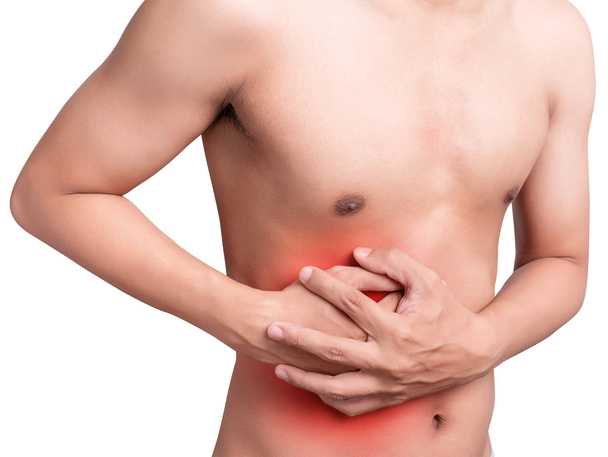 sağlık ve tıp ile mide ağrısı veya Gastroenterolog Kavramı muzdarip adam mide. Kırmızı renkte acı. Beyaz arka planda yalıtma - Fotoğraf, Görsel