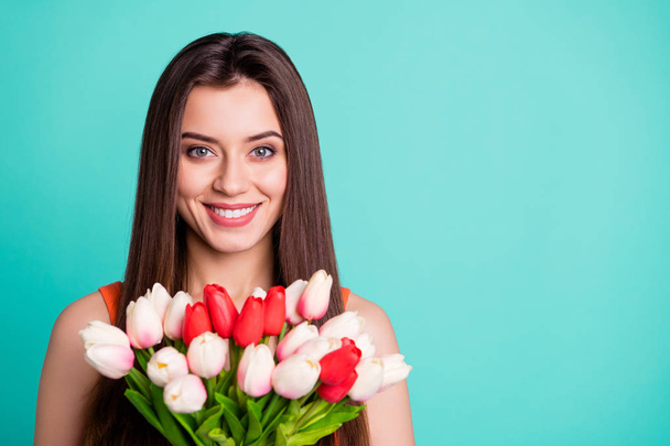 Close up photo beautiful amazing her she lady hands arms fresh flowers white red tulips surprise holiday anniversary party wife wear casual orange tank-top isolated bright teal turquoise background - 写真・画像