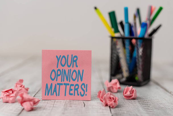 Text sign showing Your Opinion Matters. Conceptual photo show you do not agree with something that just been said Set of plain note paper with scraps and stationary on the wooden table. - Photo, Image