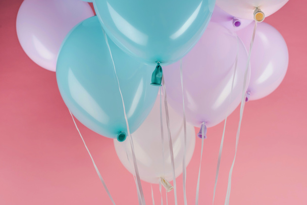 blue, white and purple festive balloons on pink background - Photo, Image
