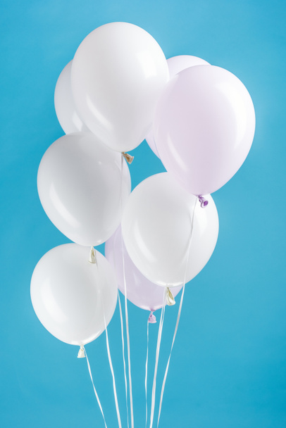 white festive balloons on colorful blue background - Фото, зображення