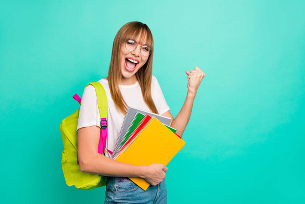 Close up photo beautiful she her lady yelling bast test results arms hands school colored notebooks staff modern backpack wear specs casual white t-shirt isolated teal green background - Photo, image
