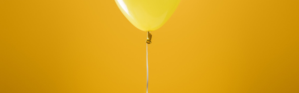festive bright minimalistic decorative balloon on yellow background, panoramic shot - Photo, Image