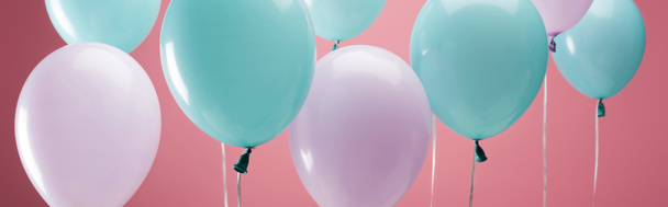 bright party multicolored balloons on pink background, panoramic shot - 写真・画像