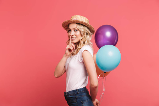 Portrait of trendy blond woman 20s wearing straw hat smiling whi - Foto, afbeelding