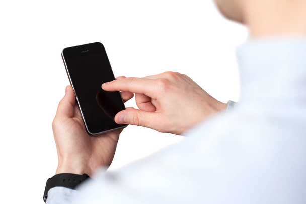 Handhaltung und Berührung auf schwarzem Smartphone mit leerem Bildschirm  - Foto, Bild