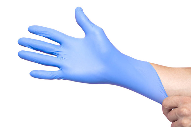 Hands wearing a blue latex glove, isolated on white background - Foto, immagini