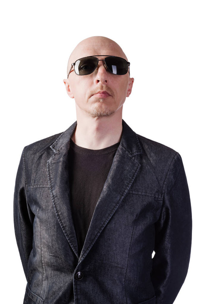 A man in a denim jacket with dark glasses. A middle-aged man of European appearance. Isolated on white background - Foto, afbeelding